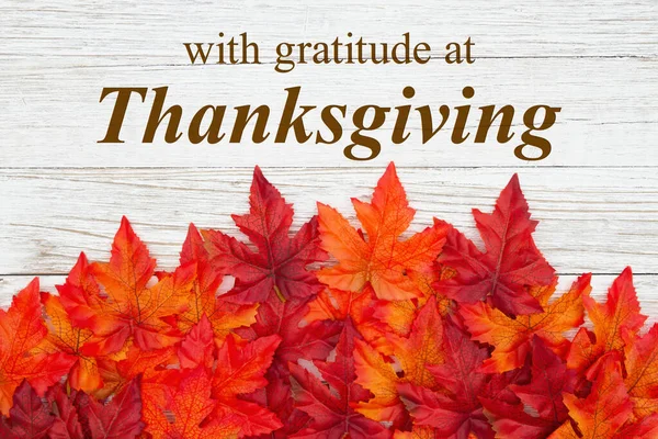 Thanksgiving greeting with red and orange fall leaves on weather — Stock Photo, Image