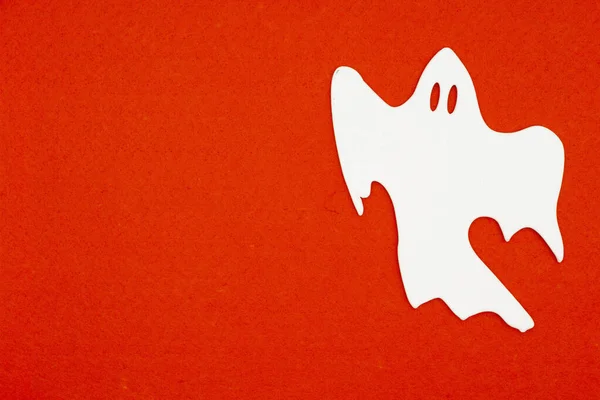 White ghost on orange felt material background — Stock Photo, Image