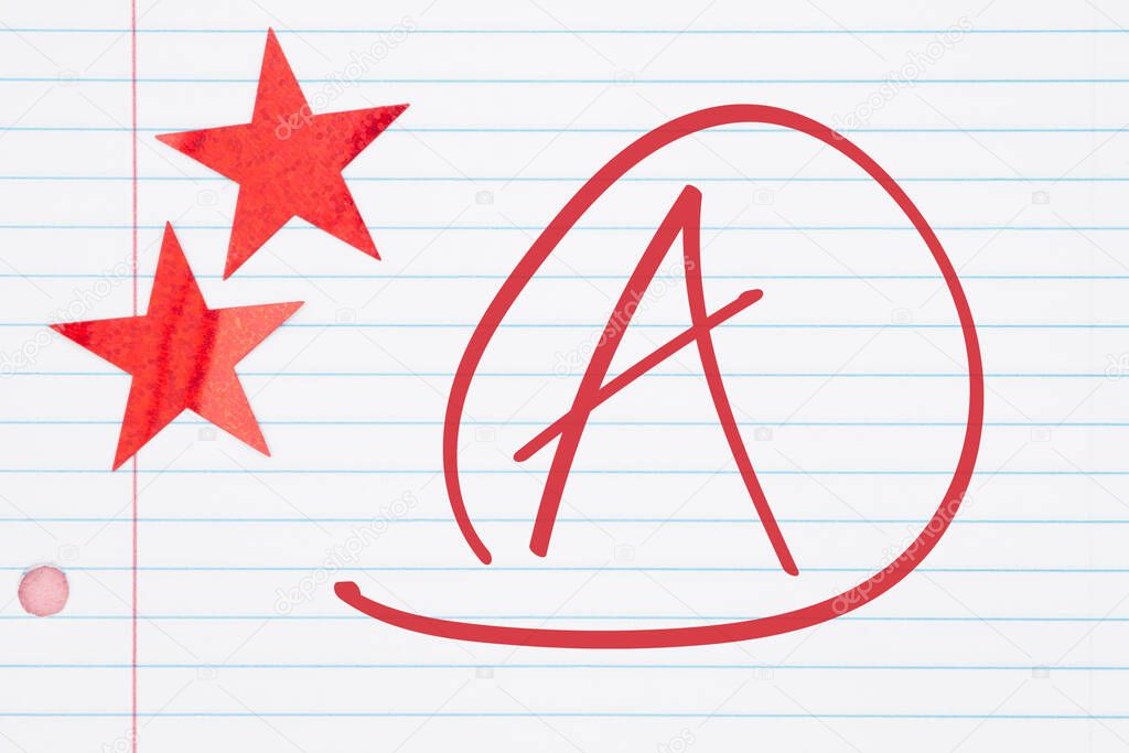 Getting a good grade A make with circle and two red stars on lined paper