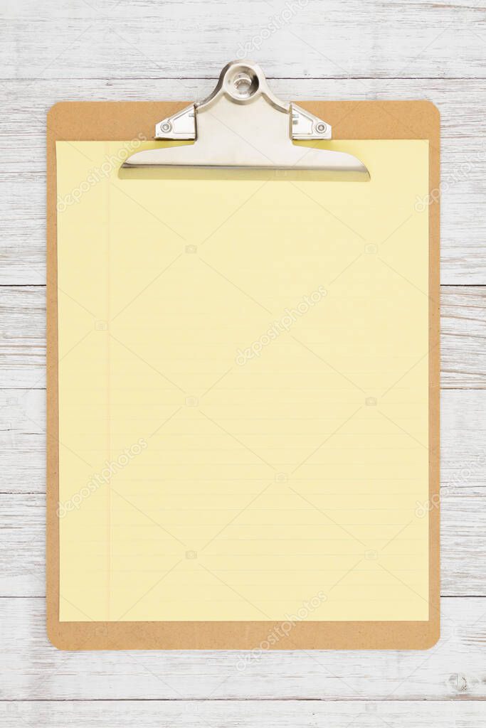 Clipboard with blank paper on weathered whitewash wood mockup with copy space for your application or checklist list message