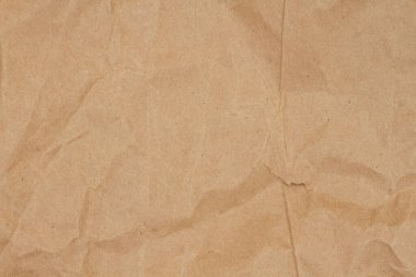 Brown distressed packaging paper background with grain texture with copy space for your packaging message or use as a texture clipart