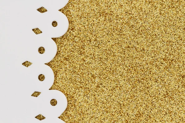 Gold glitter textured with side border paper closeup background with copy space for message or use as a texture