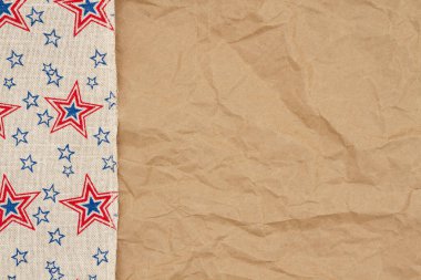 Retro USA star burlap ribbon on butcher paper background with copy space for your American message clipart
