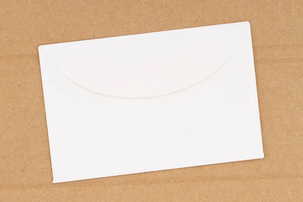 Blank White Envelope Brown Textured Cardboard Background Copy Space Message — Stock Photo, Image