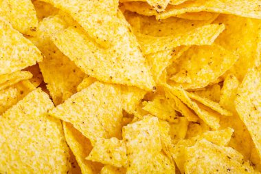 Patates cipsi arka plan. Fast Food snack doku. Tortilla cips bir doku ve arka plan olarak