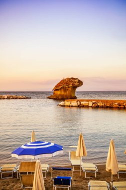 Il Fungo, rock in shape of mushroom in Lacco Ameno, part of Ischia island. Travel in Italy. Famous landmark and tourist destination. Soft focus. Copy space. clipart