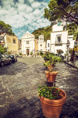 The central square of Lacco Ameno on the island of Ischia with Santa Restituta church, dedicated to the Patron of Lacco Ameno. Travel destination in Italy. clipart