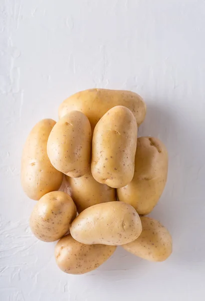 Raw organic potatoes on a white background — Stock Photo, Image