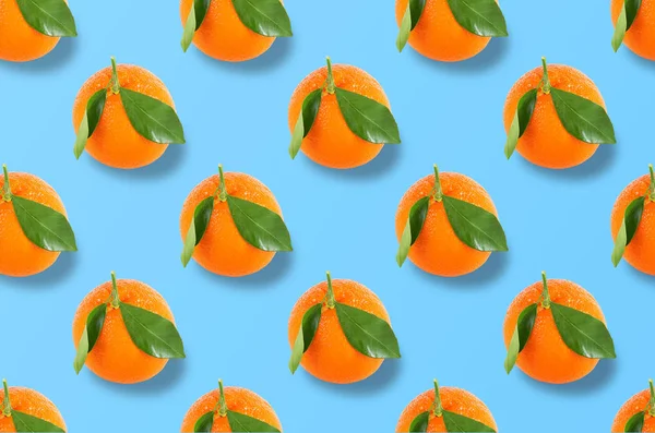 Whole orange fruits pattern on colorful background