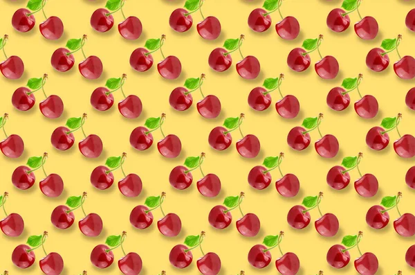 Wole cherry fruits pattern on colorful background — Stock Photo, Image