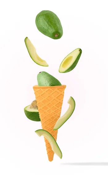 Avocado in ice cream waffle cones flying in motion on white background with clipping path as package design element and advertising. Full depth of field.