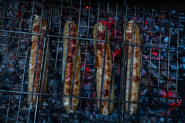 Meat cooking on the grill with open fire and coals — Stock Photo, Image