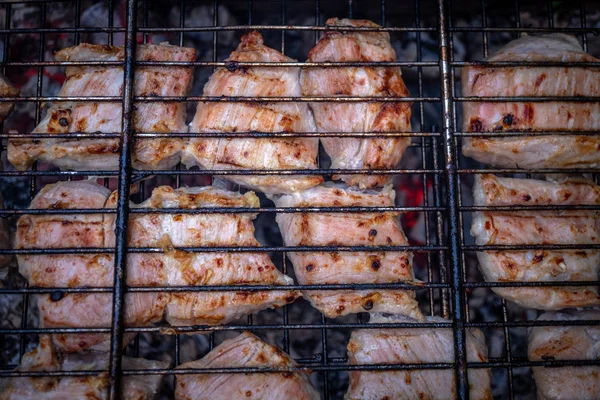 Meat cooking on the grill with open fire and coals — Stock Photo, Image