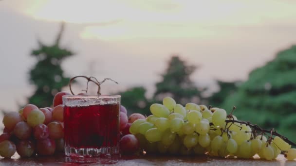 Fresh made Grape Juice in a glass — Stock Video