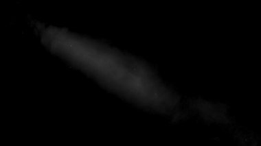 Bir ışık ışını tarafından aydınlatılmış duman