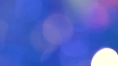 Renkli daireler yanıp sönen bulanık arka plan