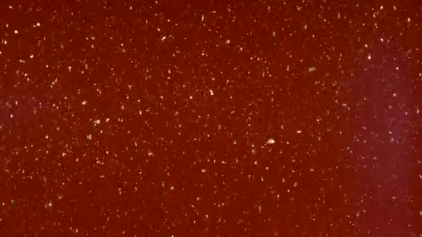 Les petites particules se déplacent au hasard sur un fond coloré .