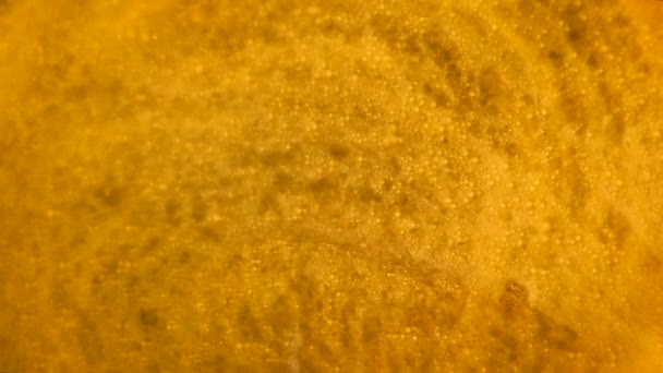 Golden moving abstract background. Gold liquid paints moving and mixing — Stock Video