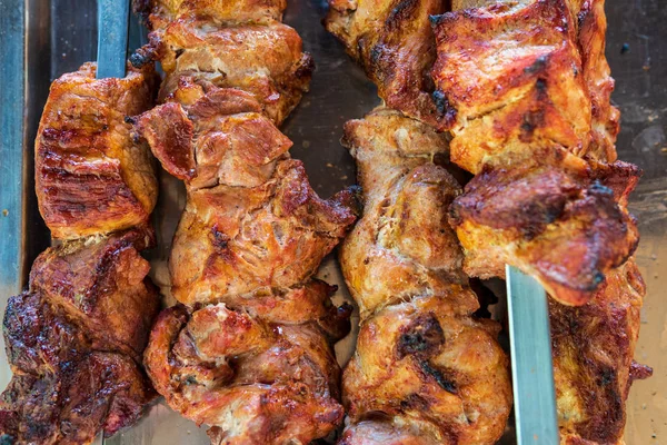 Roasted meat on a skewer. Barbecue — Stock Photo, Image