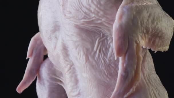 Peeled broiler chicken on a black background — Stock Video