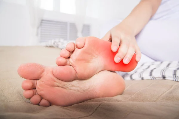Woman's leg hurts, pain in the heel, massage of female feet at home — Stock Image Woman Leg Hurts Pain Heel Massage Female Feet Home Royalty Free Stock Images