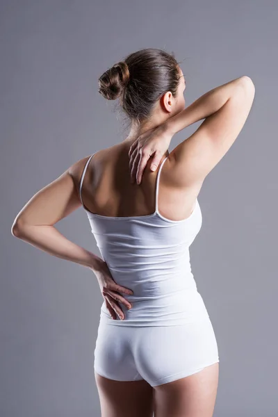 Back Pain Woman Backache Gray Background Studio Shot — Stock Photo, Image