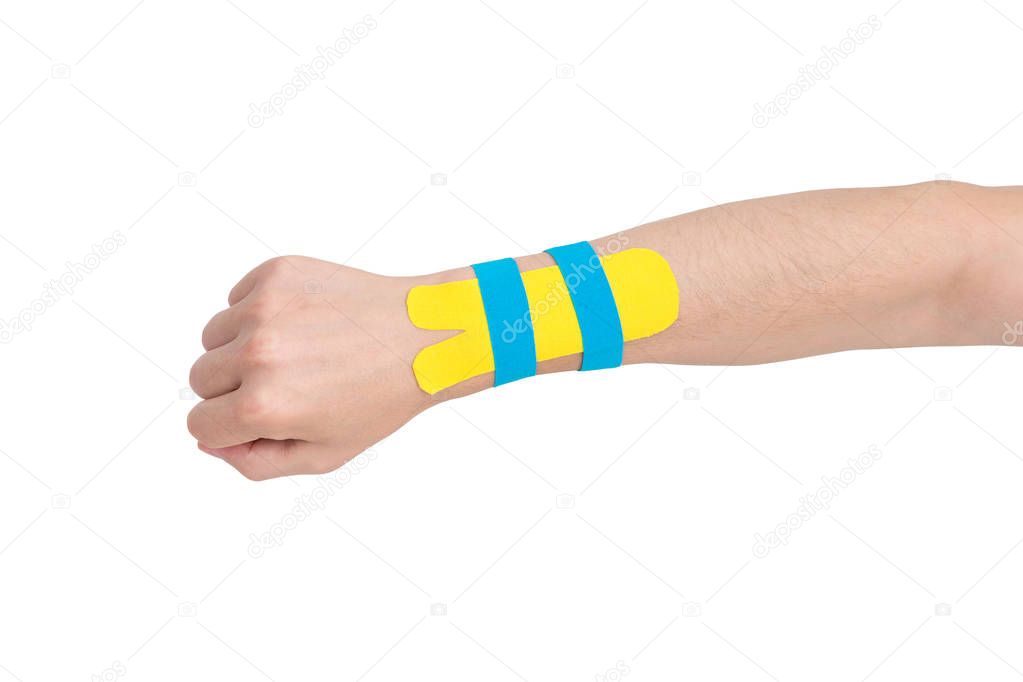 Kinesiology taping on human hand, carpal tunnel syndrome