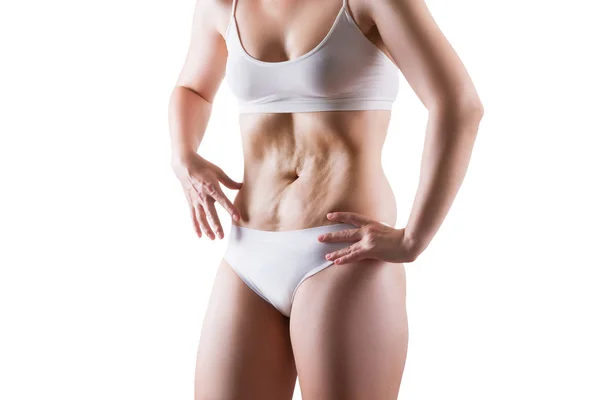 Mulher com excesso de peso em roupa interior branca fazendo exercício de vácuo, isolado em fundo branco — Fotografia de Stock