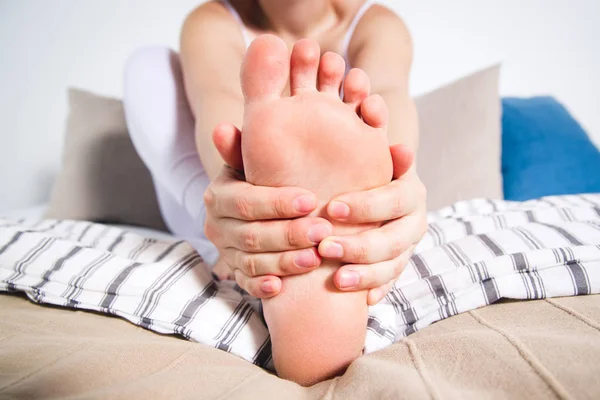 Woman's leg hurts, pain in the foot, massage of female feet — Stock Photo, Image