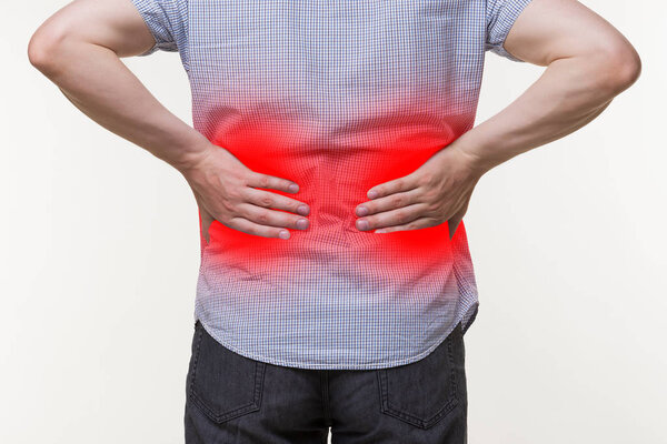 Back pain, kidney inflammation, man suffering from backache