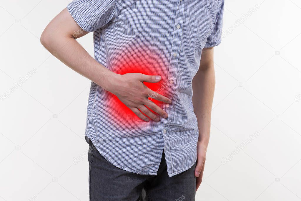 Attack of appendicitis, man suffering with abdominal pain