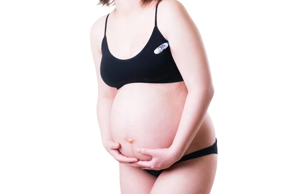 Mulher grávida mede temperatura, isolada em fundo branco — Fotografia de Stock