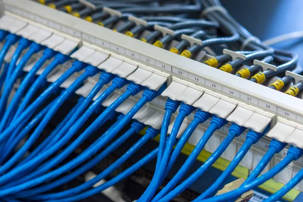 Network cabling system, UTP patch panel with cables connected