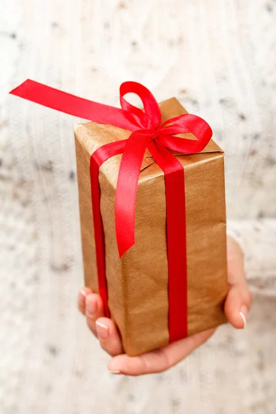 Woman Holding Gift Box Tied Red Ribbon Her Hand Shallow Royalty Free Stock Images