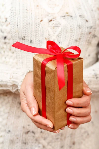 Woman Holding Gift Box Tied Red Ribbon Her Hands Shallow Stock Picture