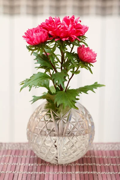 Beautiful Bouquet Red Aster Flowers Crystal Vase Wooden Napkin Blurred — Stock Photo, Image