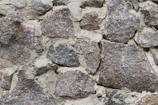 Fragment av grå stenmur med cement lösning. Framifrån. — Stockfoto