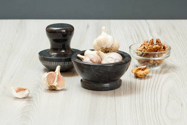 Health remedy relief foods for cold and flu with garlic and walnuts on wood boards. Foods That Boost the Immune System.