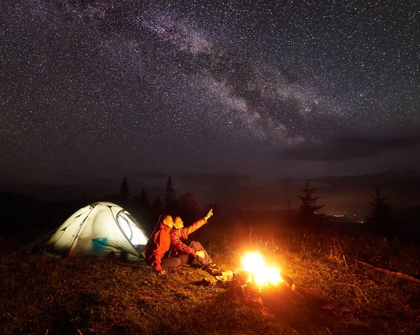 Camping Night Mountains Tourist Couple Sitting Front Illuminated Tent Lit — Stock Photo, Image