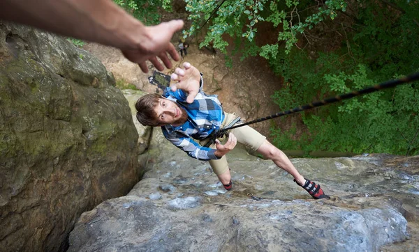 Man Hanging Rope Rock Stretching Out Hand Asking Help — Stock Photo, Image
