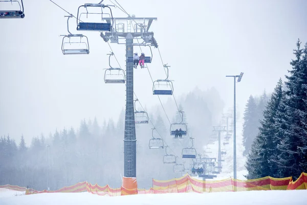 Chairlift Using Carrying Passengers Skiers Snowboarders Mountains — Stock Photo, Image