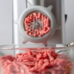 Raw beef in a meat grinder