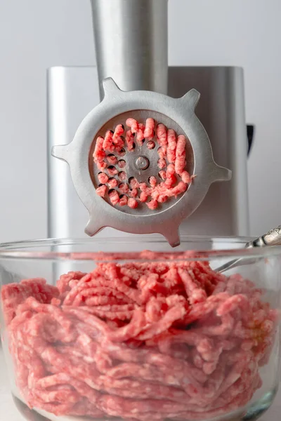 raw beef in a meat grinder