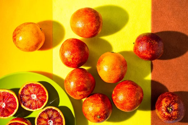 red sicilian oranges on a bright background.