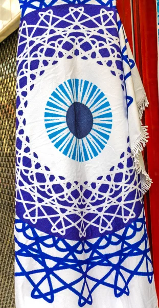 Blue White Greek Evil Eye Flag Athens Greece.  Evil Eye is a curse.  Evil eye symbols are used as a defense  to ward of eyil eye curses