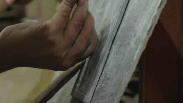 Nepalese craftsman working on traditional Mani slate stone in Kathmandu, Nepal. — Stock Video