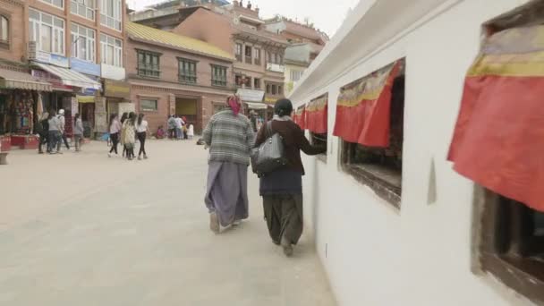 KATHMANDU, NEPAL - MARCH, 2018: Believer walk around the Boudhanath Stupa in the Kathmandu valley. — Stock Video