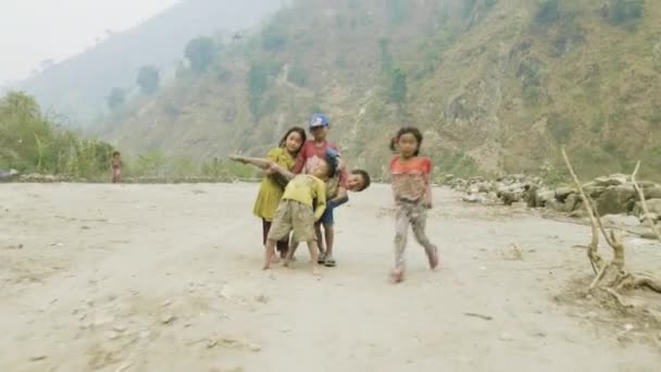 MANASLU, NEPAL - MARCH, 2018: Nepalese children smile and play in the camera. — Stock Video