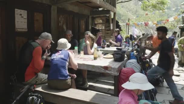 MANASLU, NEPAL - MARCH, 2018: European and american people have a lunch on Manaslu citcuit trekking. — Stock Video