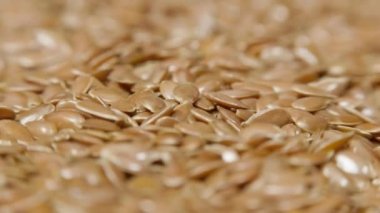 Dönen tablo, makro görünümü, sağlıklı gıda olarak keten tohumu yığını